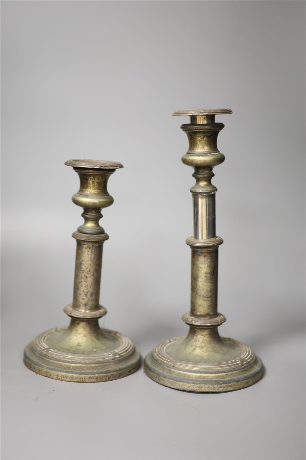 A pair of bronze rococo-style candelabra, width 25cm and a pair of telescopic candlesticks